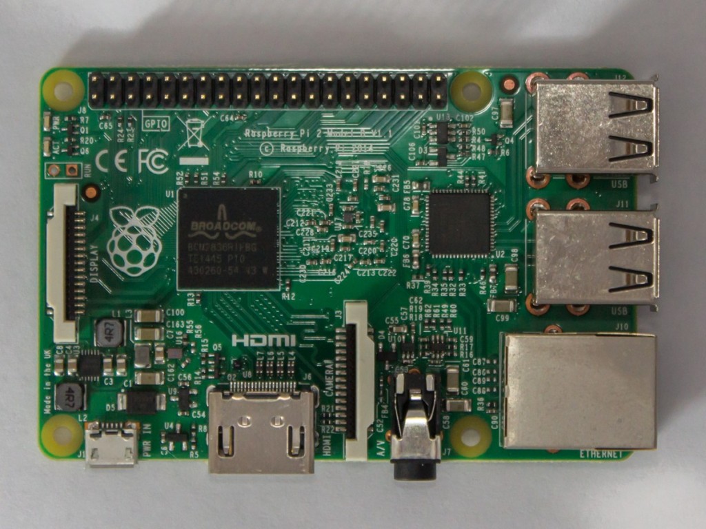 With the memory no longer mounted on top, you can see the Broadcom logo on the SoC.